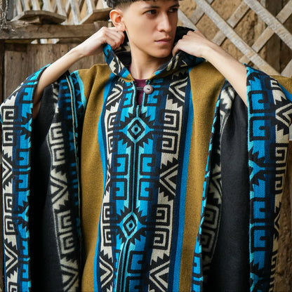 Turquoise and mustard Ecuadorian alpaca poncho with hood, worn outdoors, Alennya.